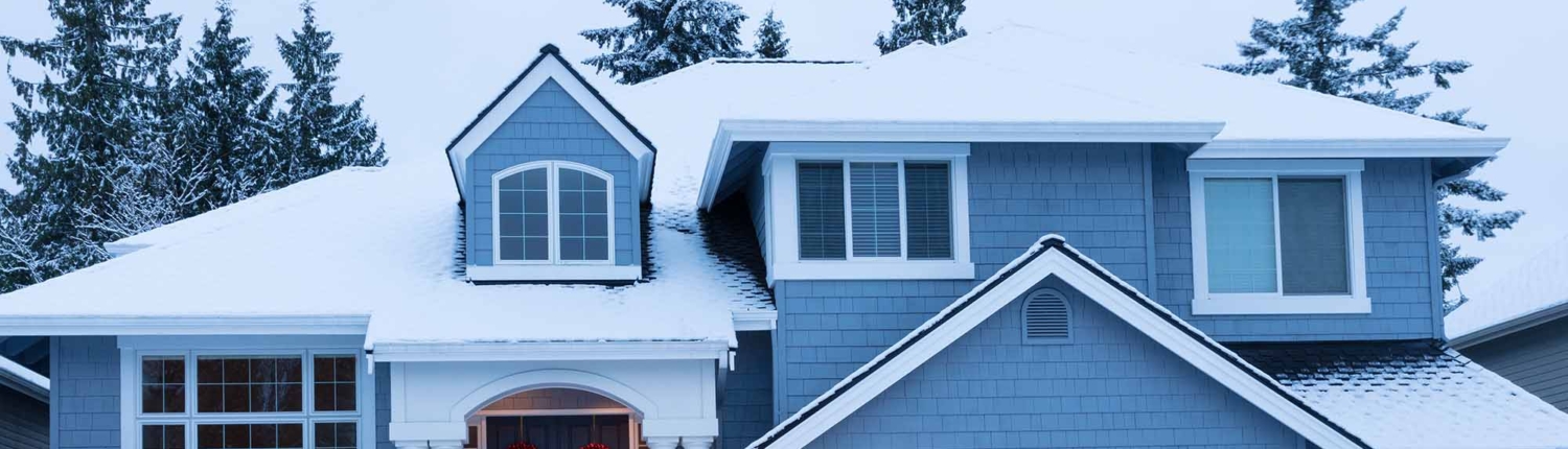 Home decorated for the winter holidays with fresh snow