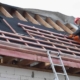 person installing roof