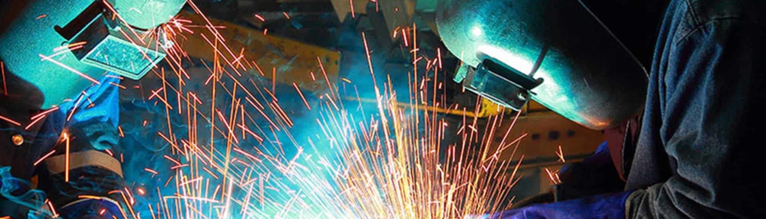 Welders manufacturing a project
