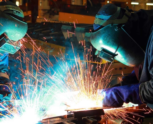 Welders manufacturing a project
