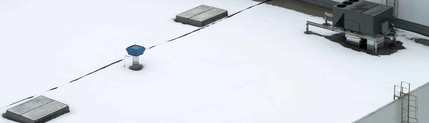 Rooftop with sheet of snow