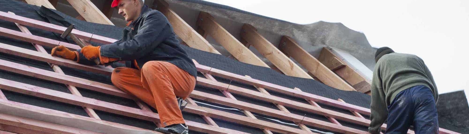 Roofers installing roof structure