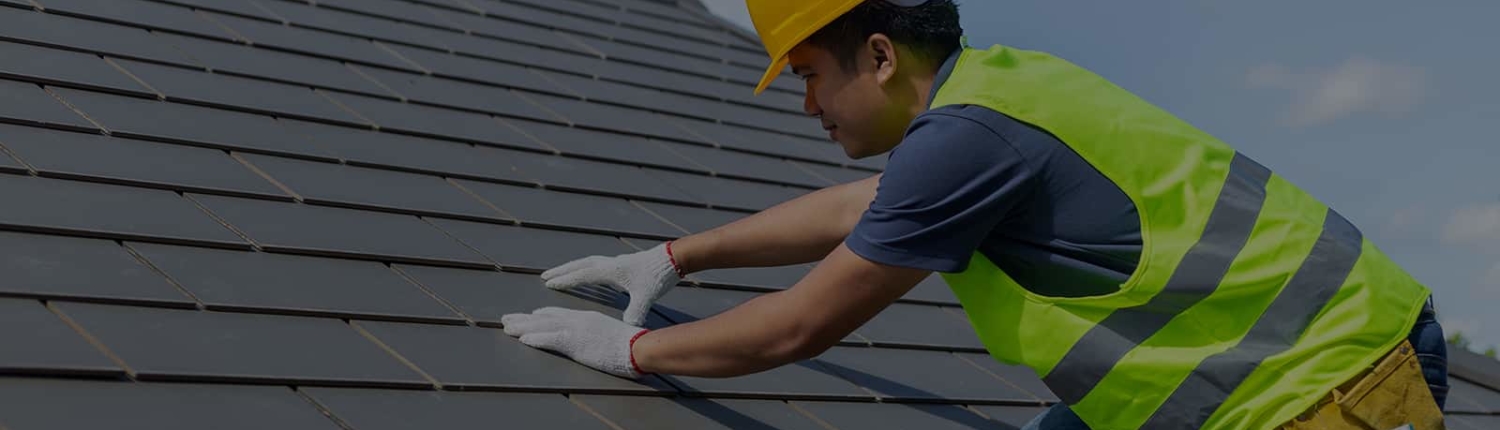 Worker installing Slate-Roof