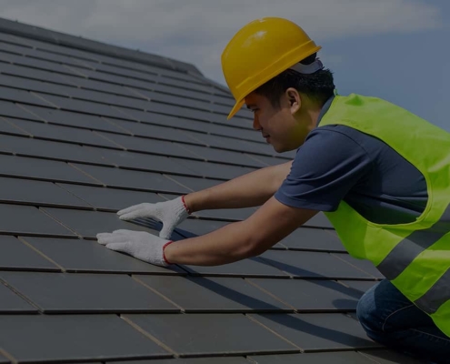 Worker installing Slate-Roof