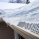 Image of ice built up on a roof gutter.