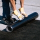 Image of a worker installing an EPDM membrane.