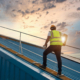 Person on top of commercial roof for inspection