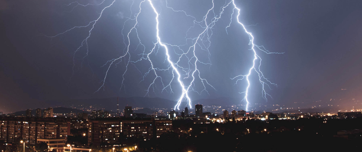 side view of a rain storm over a city