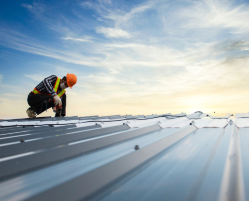 Sloped vs. Flat Metal Roofing: What’s Best for Your Commercial Building?