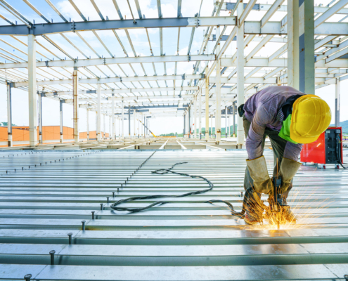 Worker welding metal structure