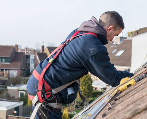 man making the construction for the solar panels